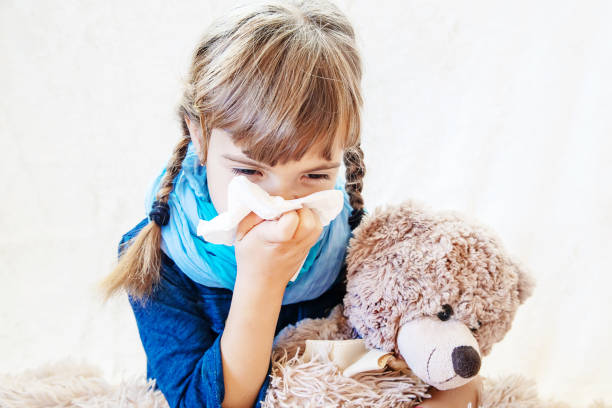 istock Ill Girl Sitting With Teddy Bear 1413663317