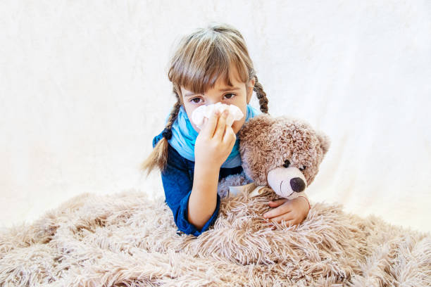 istock Ill Girl Sitting With Teddy Bear 1413663319