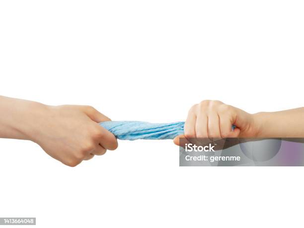 Woman Squeezing A Towel Stock Photo - Download Image Now - Towel, Squeezing, Hand