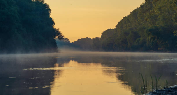 Early morning river.  fog trees. sunlight mist  water. Olanesti Moldova Dniester river reflection, beautiful   summer landscape sunrise quiet fishing spot forest