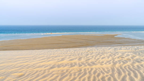 istock qatar adventurous place khor al udeid ,sea line beach during sunset. 1413665577