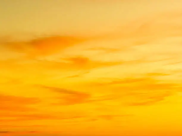 Photo of Sunset with orange clouds over the mountains