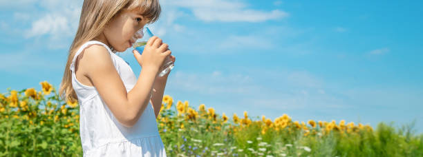istock Young Woman Standing Against Sky 1413668998