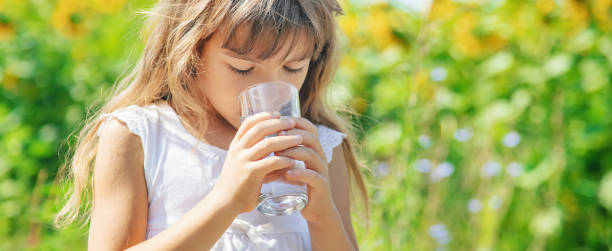 istock Young Woman Drinking Water 1413669019