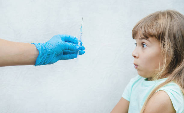 istock Side View Of Woman Holding Syringe 1413669656