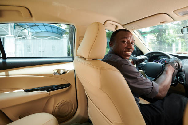 istock Taxi Driver Turning Back to Passenger 1413671995