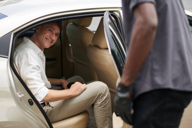 istock Businessman Talking to Taxi Driver 1413672016