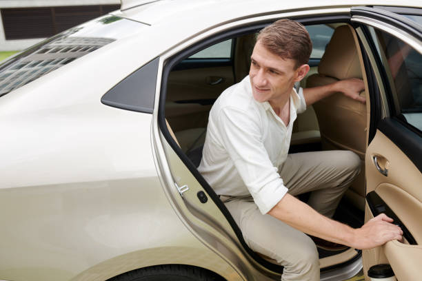 istock Businessman Opening Car Door 1413672030