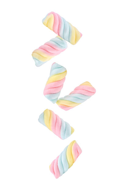 istock Colorful marshmallows candy falling in the air isolated on white 1413672162