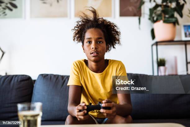 Eleven Year Old Africanamerican School Girl Playing Video Games Online  Stock Photo - Download Image Now - iStock