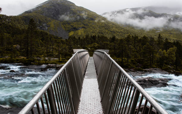 istock Likholefossen waterfall in Norway with spectacular steel bridge 1413675006