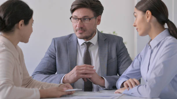 istock Business People having Conversation in Office 1413675182