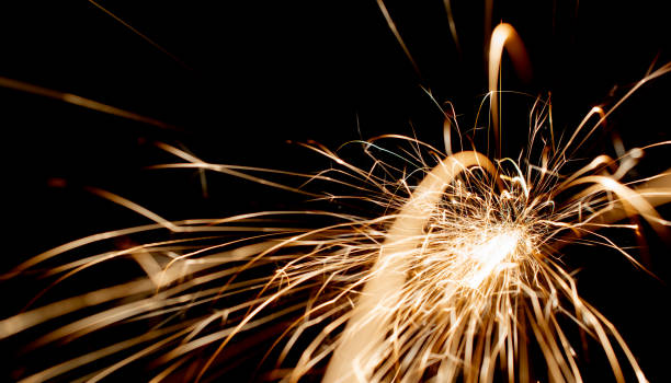 istock sparks in the dark. lines of light. 1413675911