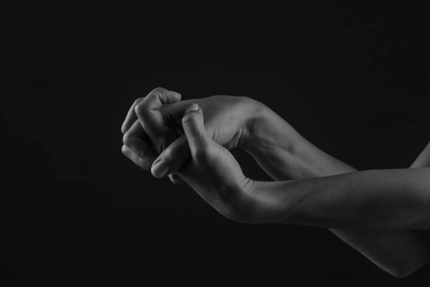 Black and white photo of wrinkled hands of senior generation