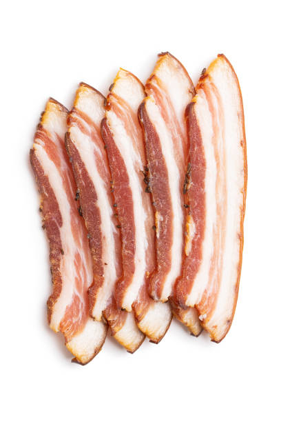 Sliced smoked bacon isolated on white background. Sliced smoked bacon isolated on a white background. uncooked bacon stock pictures, royalty-free photos & images