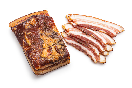 Sliced smoked bacon isolated on a white background.