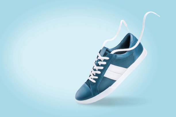 istock Blue sneakers on a blue background 1413681440