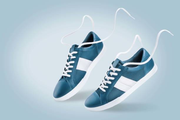 istock Blue sneakers on a blue background 1413681446