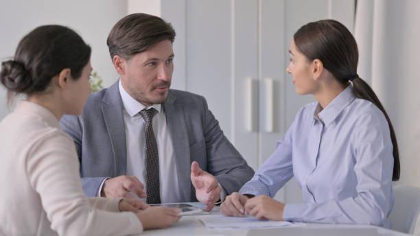 istock Business Person having Conversation in Office 1413682370
