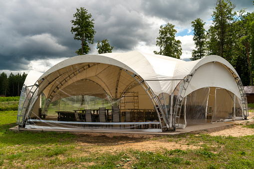 marquee. a huge tent for outdoor events. outbound trade, festival.