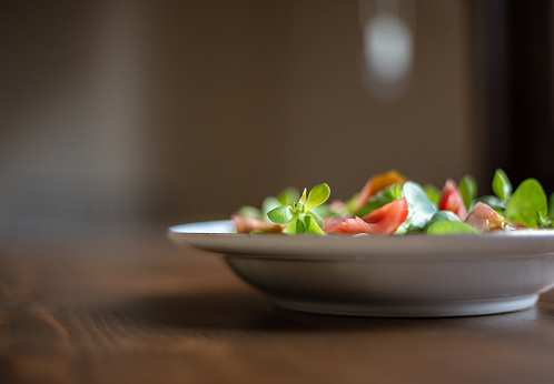 Purslane and tomato salad in plate
Close-up