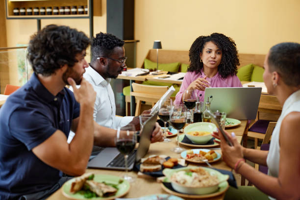 istock A female manager has a briefing with employees in a restaurant. 1413691341