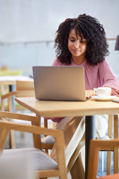 istock A freelancer sits in a cafe, typing on the laptop. 1413691356