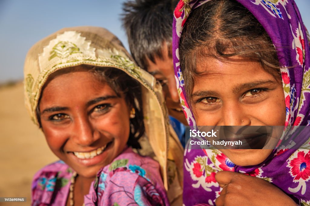 Happy Gypsy Indian children, desert village, India Happy Gypsy Indian children - desert village, Thar Desert, Rajasthan, India. Adult Stock Photo