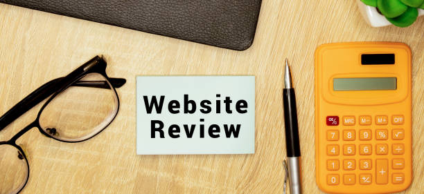 istock Text Website Review on sticker on the calculator, business concept 1413698055