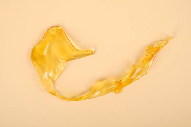 istock high thc, cannabis wax marijuana concentrate on yellow background macro 1413698263