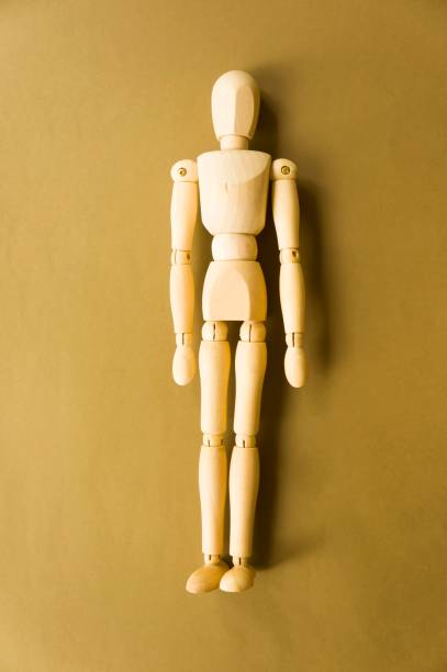 istock wooden doll on a kraft background. Creativity and art 1413700823