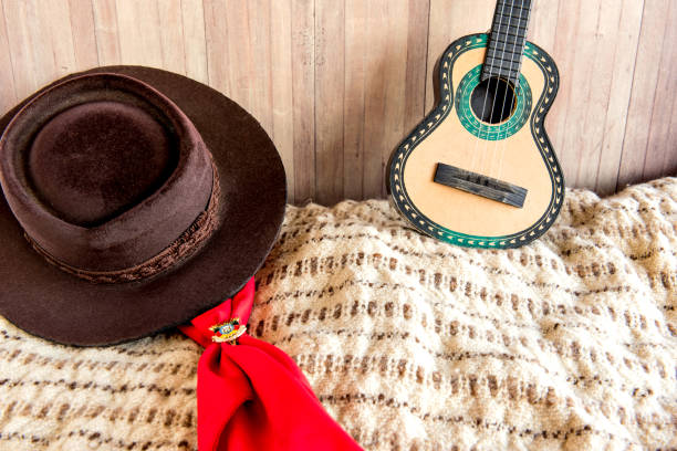 istock Gaucho tradition, hat, red scarf, poncho and guitar 1413701875