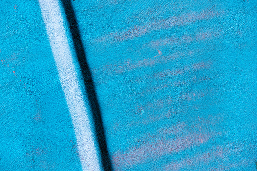 This is a close up abstract photograph of an exterior wall covered with spray paint.