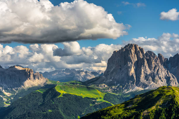 Scenery of Dolomites with the St. John's in Ranui Chapel, Santa Maddalena at sunset. Italy Seceda peak. Trentino Alto Adige, Dolomites Alps, South Tyrol, Italy. Odle mountain range, Val Gardena. Majestic Furchetta peak. Odles group seen from Seceda, Santa Cristina Val Gardena. summer flower lake awe stock pictures, royalty-free photos & images