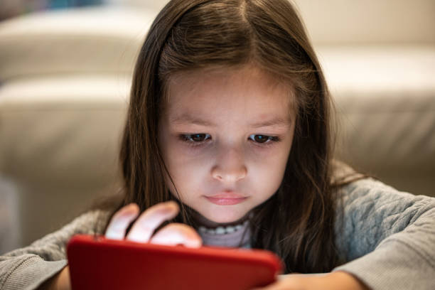 istock Girl with mobile phone visual impairment possible myopia 1413728648