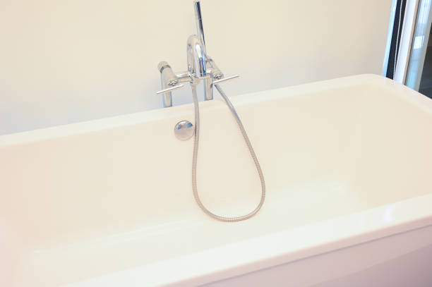 istock hydrant shower with bathtub in bathroom 1413730736
