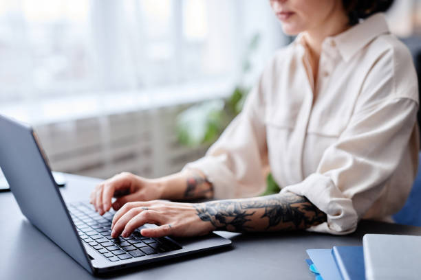 istock Woman Typing at Keyboard 1413731418