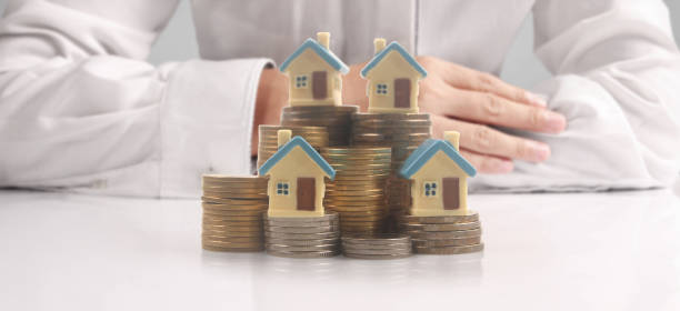 istock House Residential Structure in  hand 1413732133
