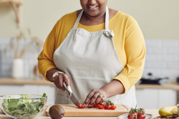 istock Black Woman Cooking in Kitchen 1413732221