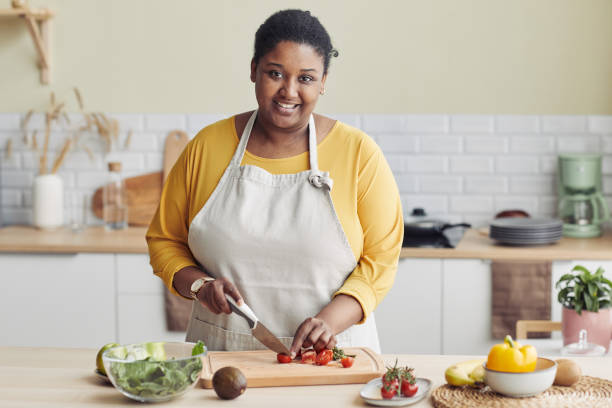 istock Young Black Woman Cooking in Kitchen 1413732226