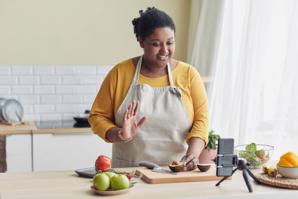 istock Woman Recording Cooking Video 1413732230