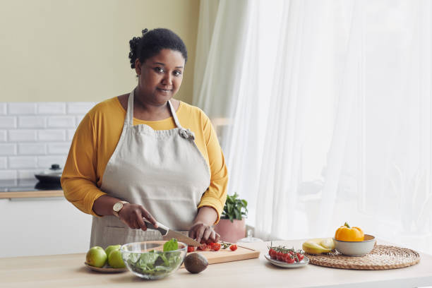 istock Young Black Woman Cooking 1413732231