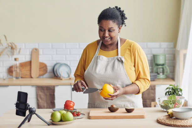 istock Black Woman Recording Cooking Video 1413732232