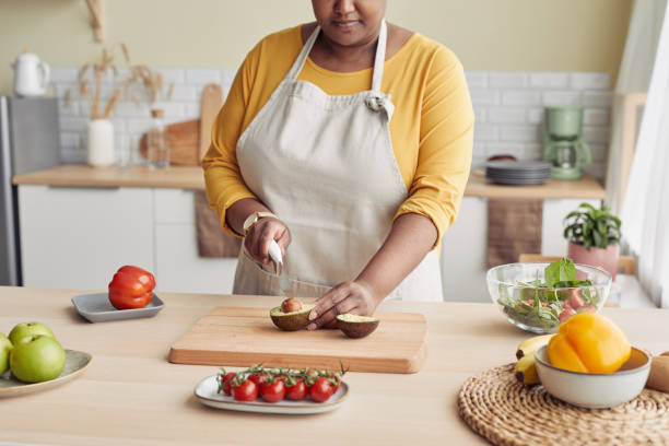 Black Woman Cooking at Home