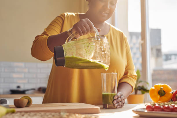 Woman Making Healthy Smoothie Closeup