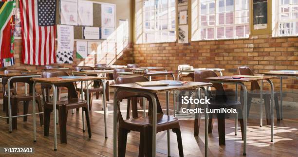 Empty Classroom With Wooden Desks Table And Chairs For A Lesson Inside An Elementary Middle Or High School Education Learning And Knowledge To Study For Teaching Academic Students Kids And Youth Stock Photo - Download Image Now