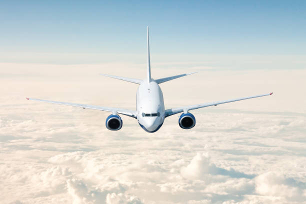 istock A passenger airplane flies above the clouds 1413733480