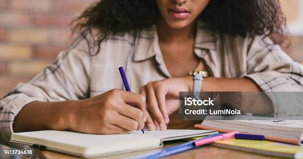 Clever Smart And Intelligent Female Student Writing In A Book In A Classroom In College Closeup Of African Woman Studying And Drafting Notes In A Notebook Inside A Class At University Stock Photo - Download Image Now