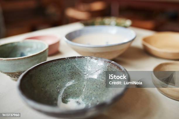 Empty Japanese Ceramic Plates Or Bowls With A Traditional And Vintage Design On A Kitchen Table Closeup Detail Of Antique Style Dishes Or Pottery A Dining Setup Or Decor At A Ceremony Stock Photo - Download Image Now