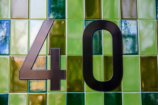 Close-up of three-dimensional circuit board number 2 on white background.